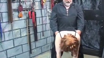 Mature torture session with a breasty woman in a casual bondage setting